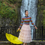 Angela at Multnomah Falls holding yellow umbrella